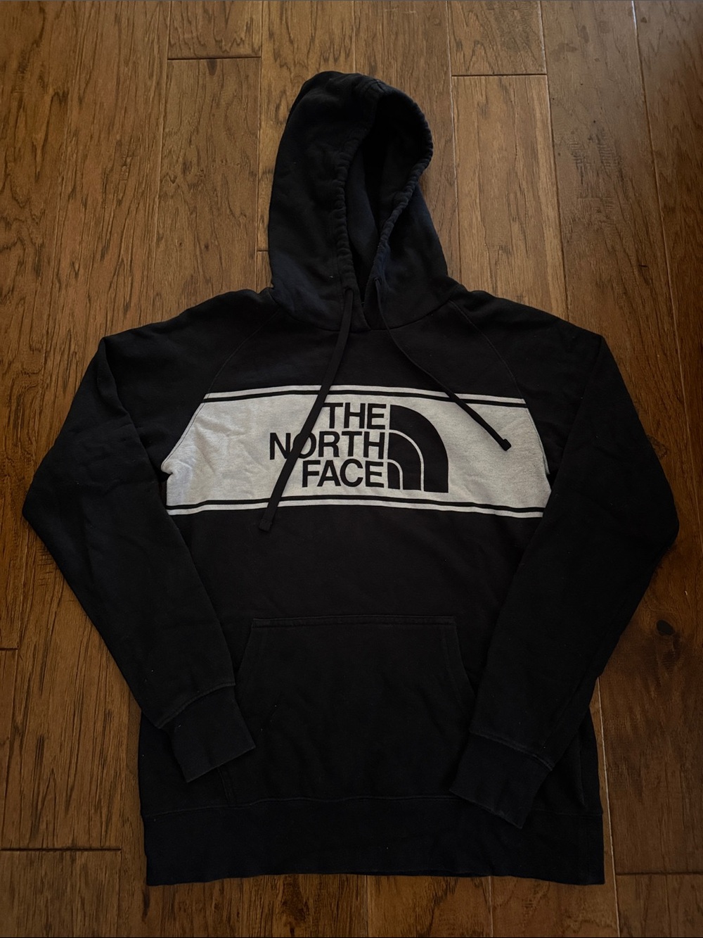 The North Face Black Pullover Hoodie with White Logo Stripe